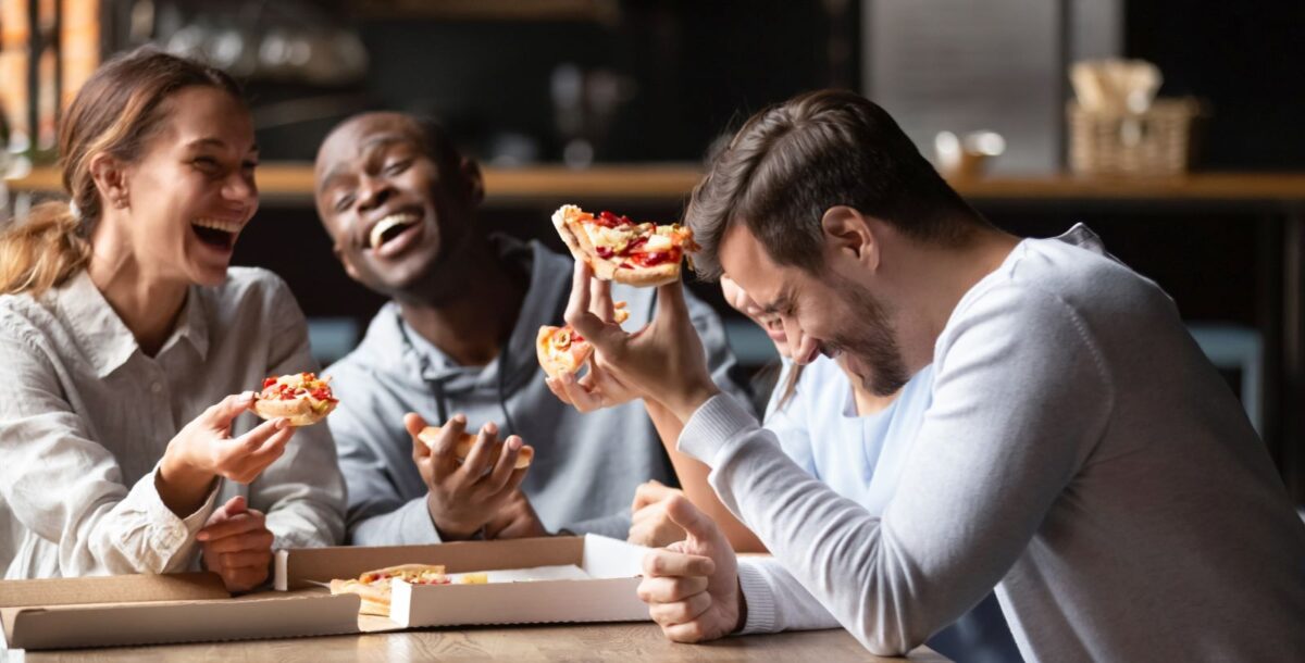 Group of friends eating pizza