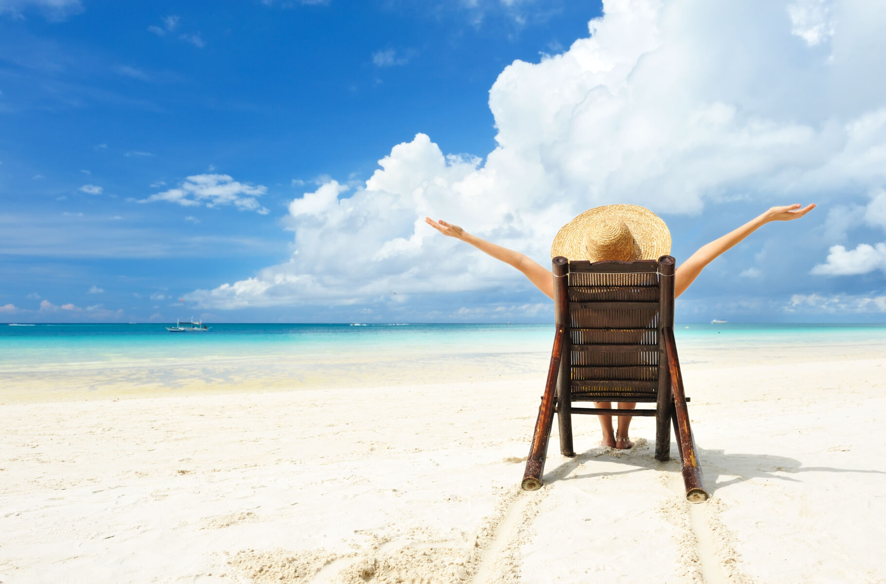 person on beach in chair